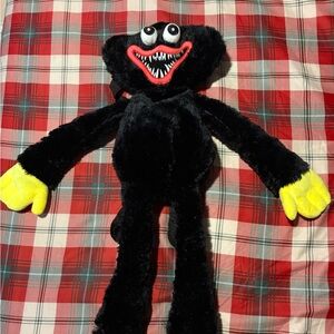 Black Plush Backpack with Yellow Hands